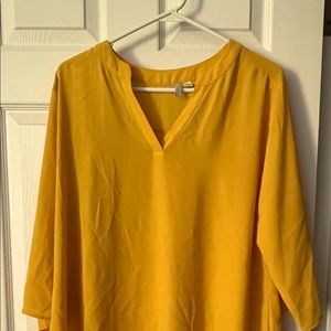 Mid-sleeve business casual yellow top. Buttons on the elbows. 14-16.